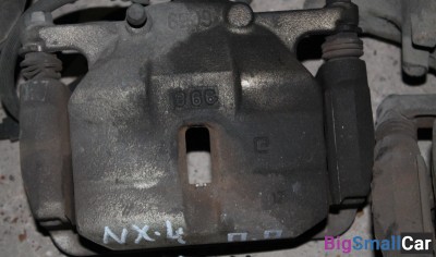 Суппорт передний правый Nissan x-trail t31